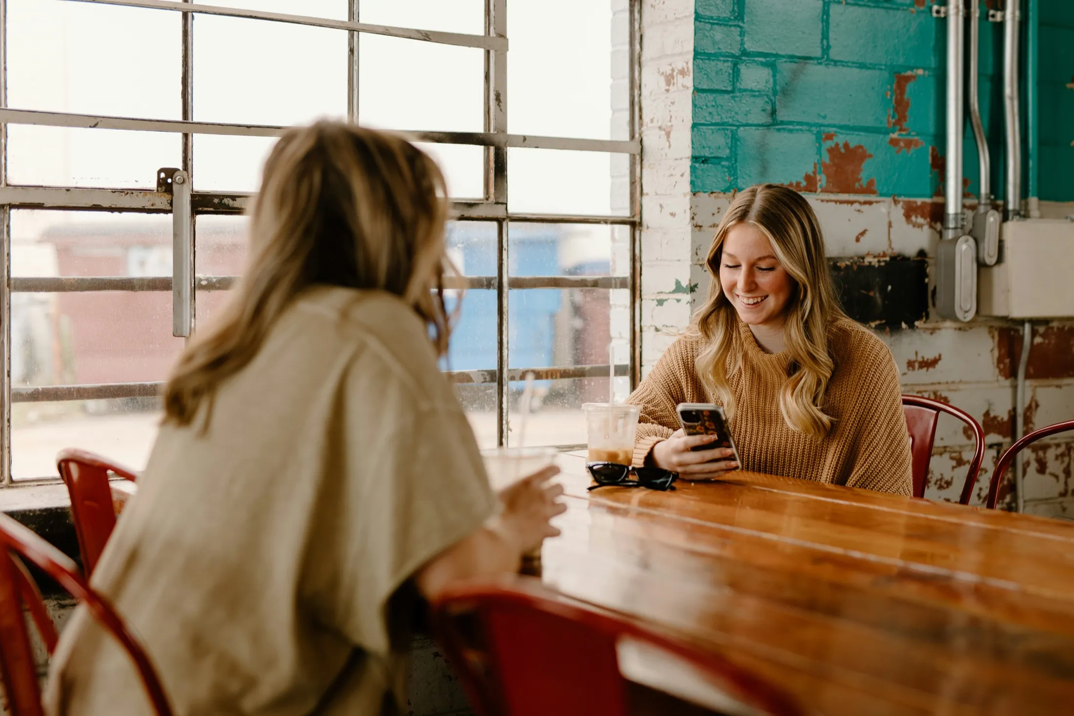 Two colleagues reading over coffee